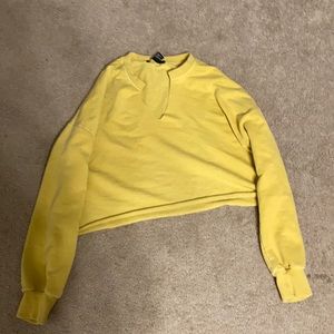 A crop top that is pale yellow